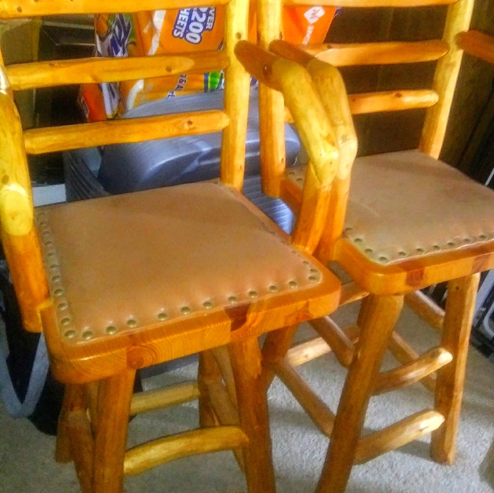 2 log swivel tall chairs